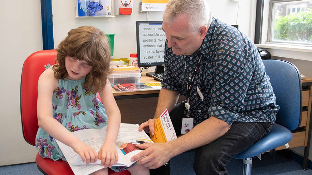 ECLO Mark Chapman, at Luton hospital supporting a child with sight loss.