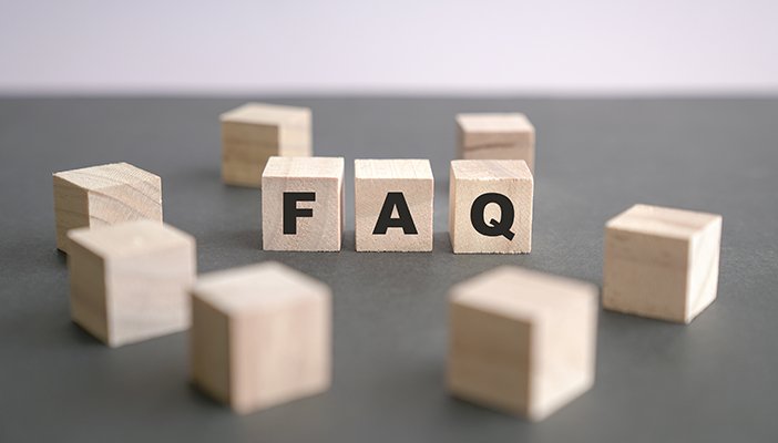 Wooden blocks, three of which say FAQ
