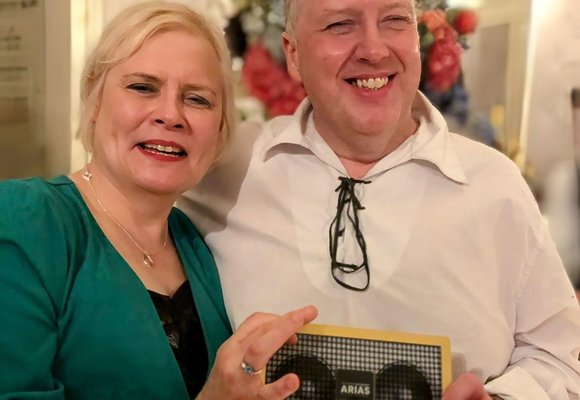 Yvonne Milne and Allan Russell from RNIB Connect Radio at the ARIAS, holding gold award for best community station.