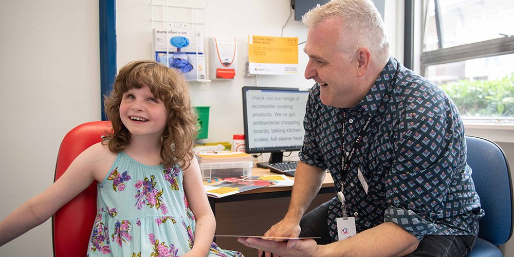 ECLO Mark Chapman, at Luton hospital supporting a child with sight loss.
