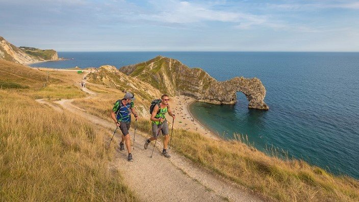 Image of people trekking the the Jurassic coast.