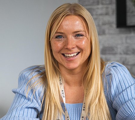 Eye Care Liaison Officer (ECLO), Jenny smiling directly at the camera.